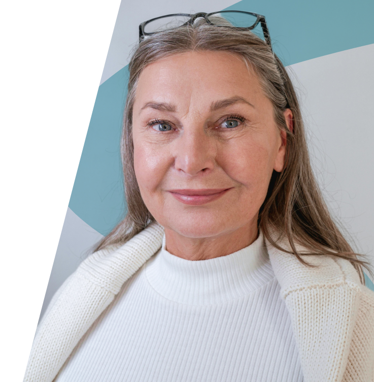 A 60-70 year old female with long gray hair, wearing glasses on top of their head, is dressed in a white turtleneck sweater and a cream-colored cardigan. The background features abstract shapes in shades of blue and gray.